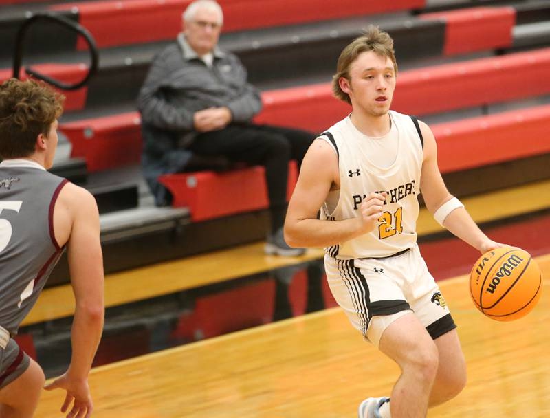 Putnam County's BRaden Bickerman looks to pass the ball off as Illinois Valley Central's Grady Read defends during the 50th annual Colmone Classic on Thursday, Dec. 12, 2024 at Hall High School.