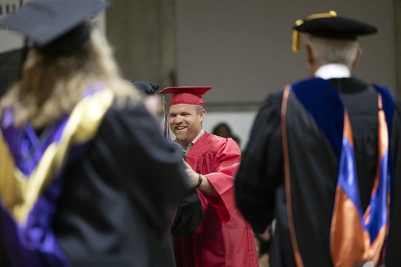 Kyle Kellan, SVCC school resource officer, was specially recognized Friday, May 9, 2025, as he walks across the stage to collect his diploma during commencement.