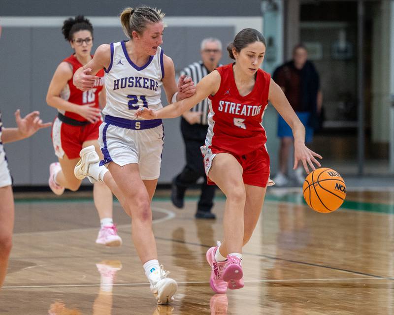Audrey Arambula (5) of Streator dribbles ball whilst Kendall Whiteaker (21) of Serena runs beside on Monday, November 17, 2025 at Seneca High School in Seneca.