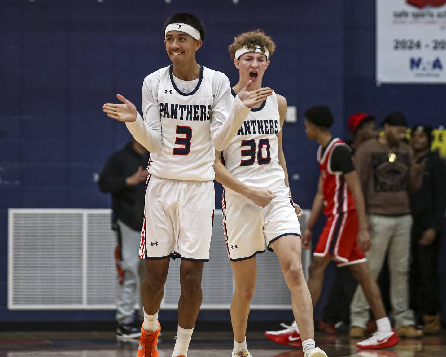 Oswego celebrates their win over West Aurora in their basketball game between West Aurora at Oswego Monday, Nov 24, 2025 in Oswego.