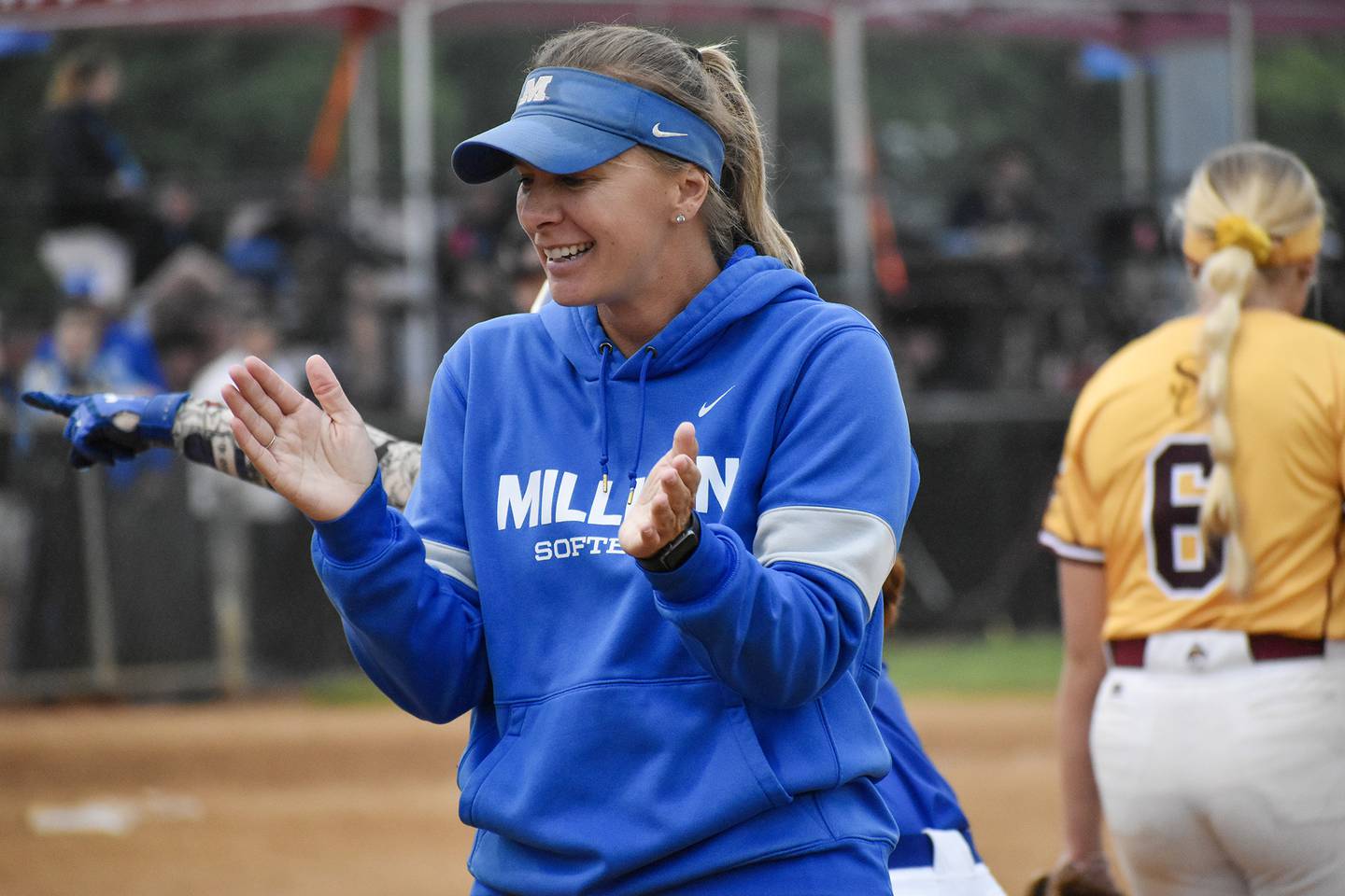 Millikin softball coach Katie Tenboer claps during a game at the NCAA Division III World Series. Tenboer, a Morrison native, led the Big Blue to the D-III championships for the first time in program history.