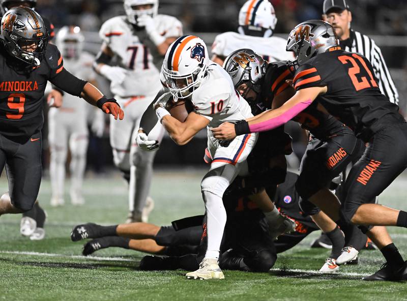 Oswego's MARIANO VELASCO (10) gains yards after a catch during the conference game against Minooka on Friday, OCT. 10, 2025, at Minooka.