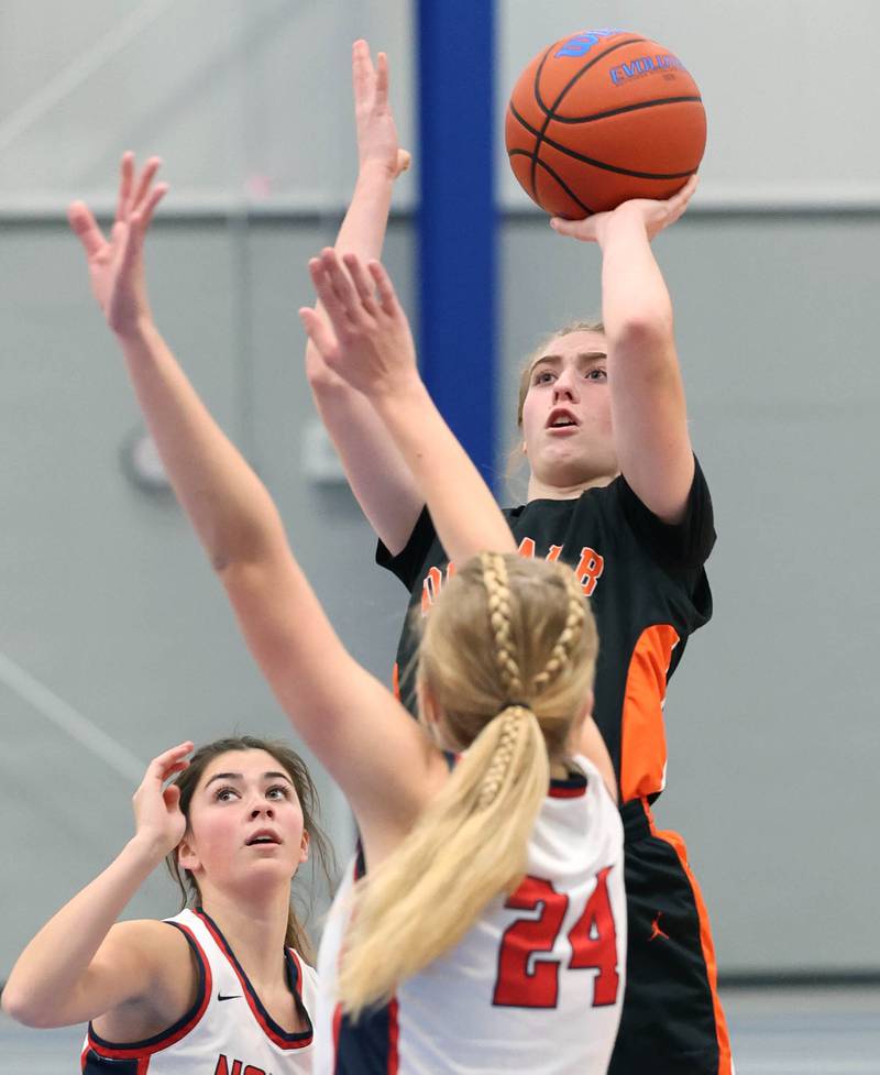 DeKalb’s Olivia Schermerhorn shoots over Belvidere North's Brooke Bottcher during their game Friday, Nov. 17, 2023, in the Mark Einwich Varsity Girls Basketball Rockets Kickoff Tournament at Burlington Central High School.