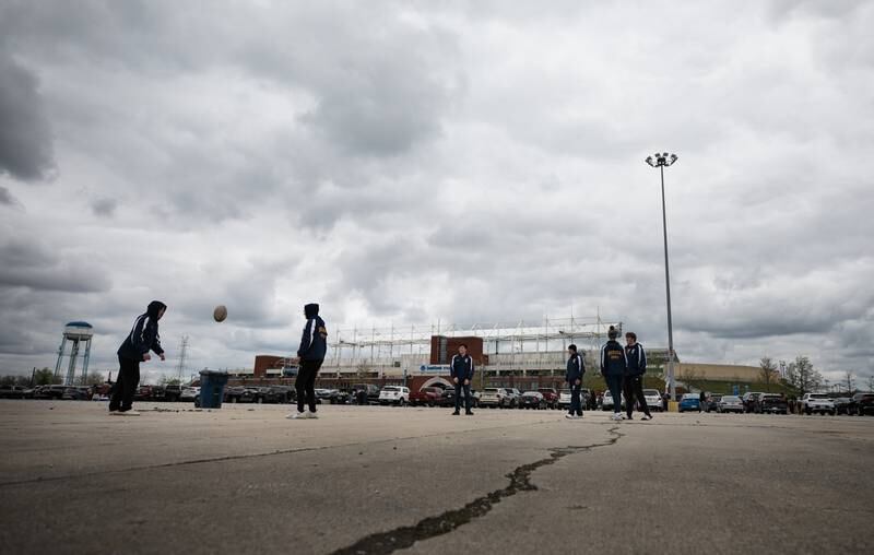 Members of the Neuqua Rugby Club, get in some rugby skill drills while tailgating outside Seat Geek Stadium before a Chicago Hounds rugby game in Bridgeview, on Sunday April 23, 2023.