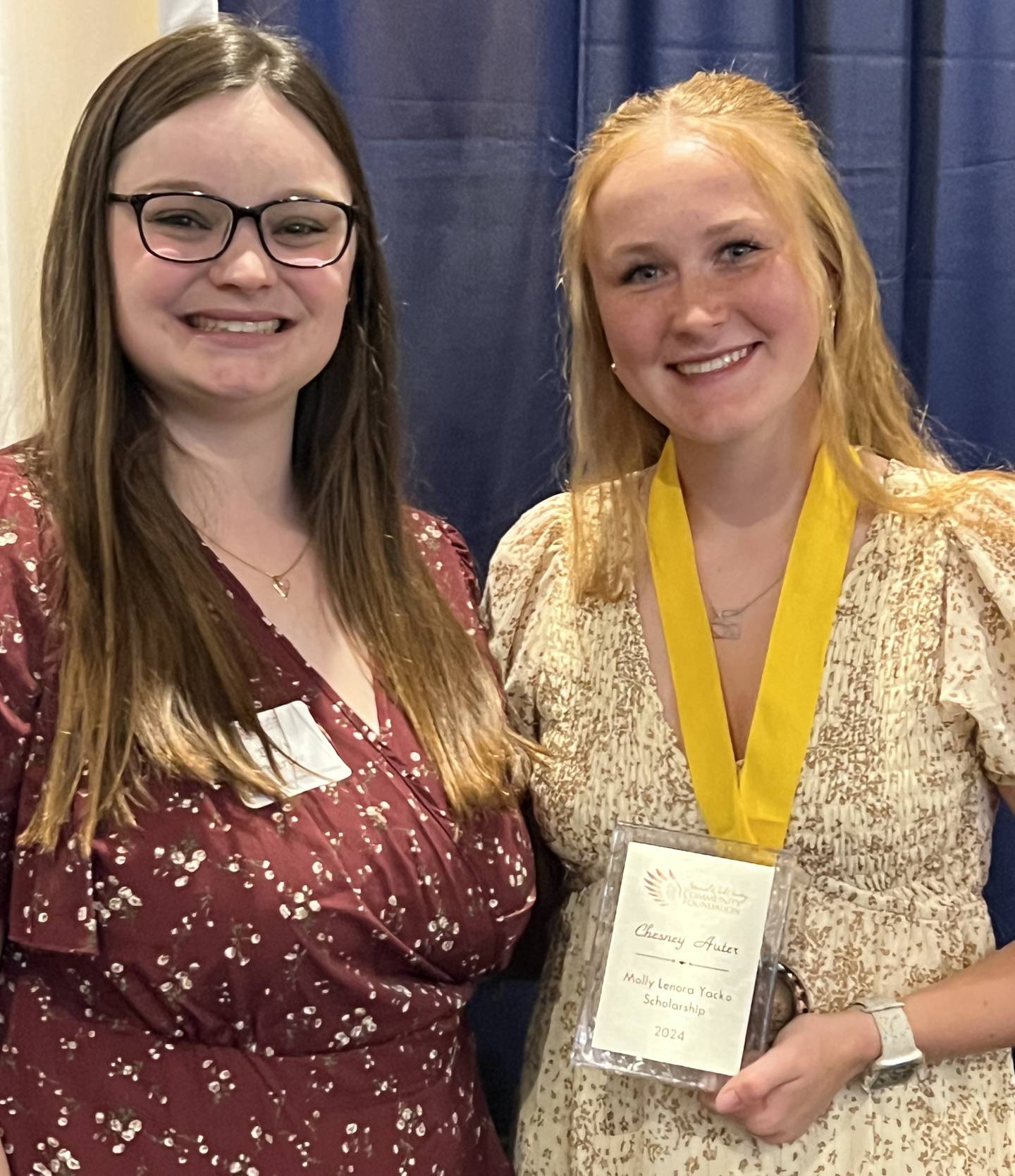 Chesney Auter of Ottawa (left) stands with Emily Yacko Hardee, sponsor of the Molly Lenora Yacko Memorial Scholarship. Auter is the first recipient of the $1,000 scholarship honoring Emily’s cousin Molly who died from suicide at age 20.