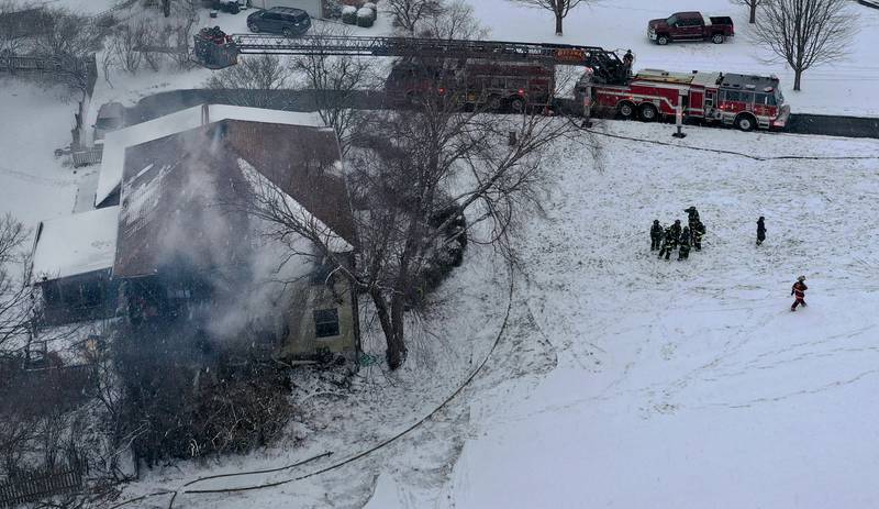 Firefighters work the scene of a structure fire on Friday, Jan. 10, 2025 at a residence located in the 2500 bock of East 1569th Road (Covel Bluff Lane) in Ottawa. The fire was upgraded to the second alarm. Firefighters from Oglesby, Utica, Grand Ridge, Marseilles, Tonica and others assisted with the fire.
