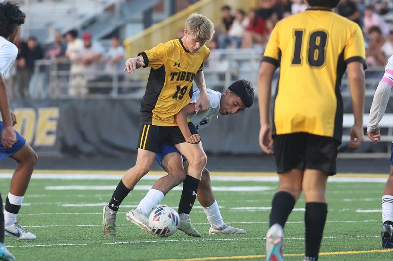 Joliet Central’s Ramon Zavala kicks away the ball from Joliet West’s Ethan Podmolik on Tuesday, Oct. 3, 2023 in Joliet.