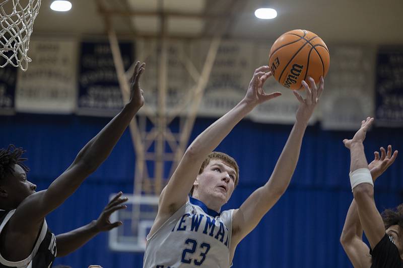 Newman’s John Rozwee works for a rebound against Kewanee Friday, Jan. 10, 2025.