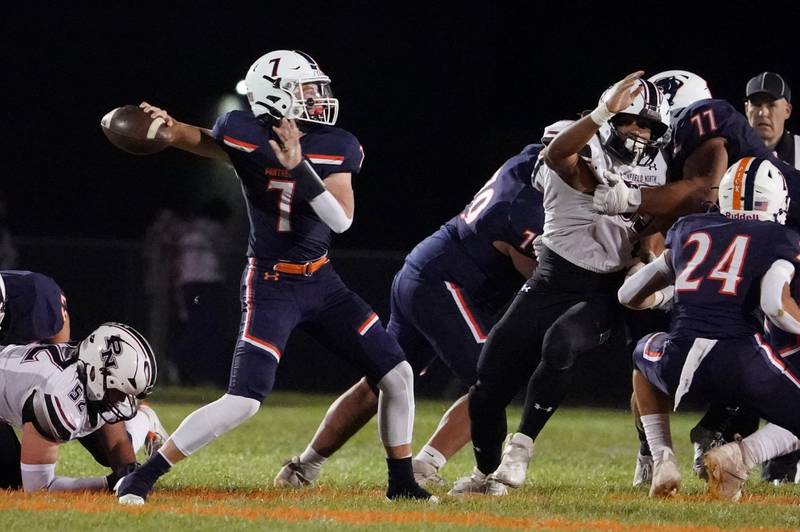 Oswego’s Brett Connolly (7) throws a pass against Plainfield North during a football game at Oswego High School on Friday, Sept. 27, 2024.
