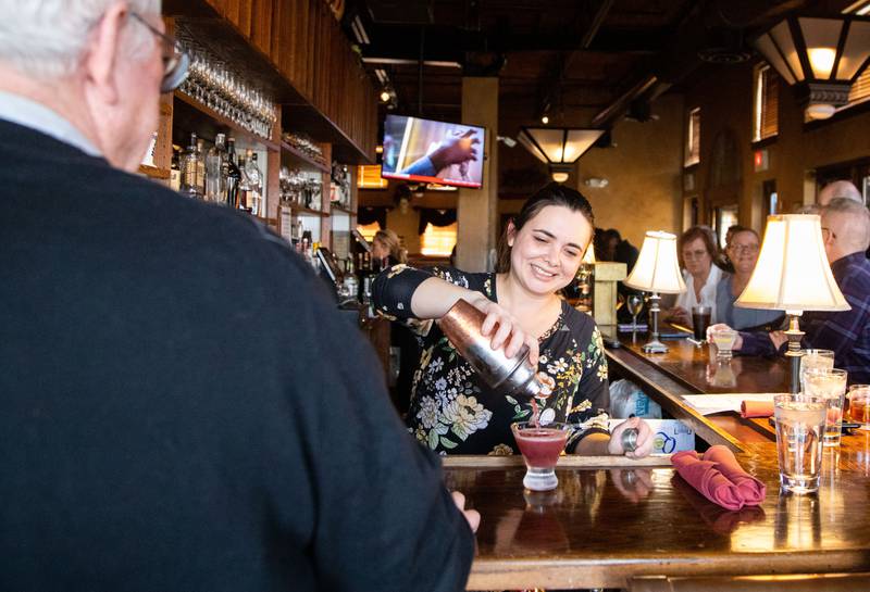 Bartender Katie Smith pours a drink for a customer at Tribella Bar and Grill in Batavia on Sunday, March 26, 2023.