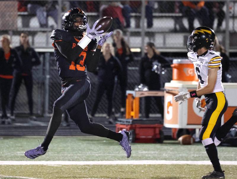 DeKalb's Davon Grant catches a 65-yard touchdown pass as he gets behind Andrew’s Connor Vrastil during their game Friday, Oct. 16, 2025, at DeKalb High School.