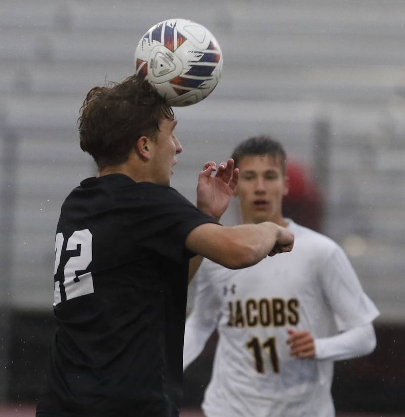 Huntley's Tyler Murray heads the ball away from Jacobs' Ethan Aldrete during an IHSA Class 3A Huntley Regional boys soccer semifinal match on Tuesday, Oct. 21, 2025, at Huntley High School.