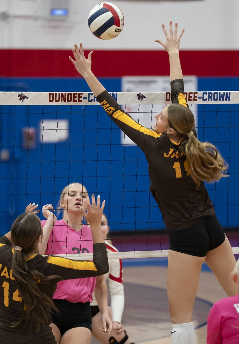 Jacobs' Gracyn Sanders jumps to block a ball at the net during their game against Dundee-Crown on Thursday, October 16, 2025 at Dundee-Crown High School in Carpentersville. Ryan Rayburn for Shaw Local