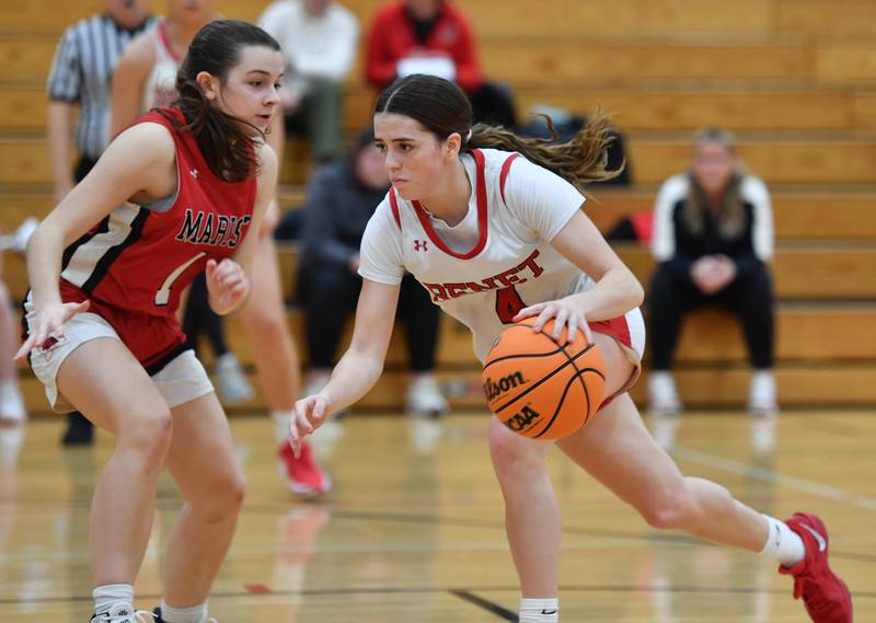 Benet’s Ava Mersinger drives past Marist’s Olivia Cosme during a game on January 8, 2025 at Benet Academy in Lisle.