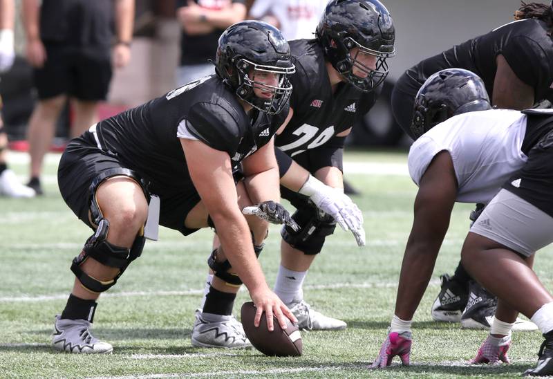 Northern Illinois Huskies center Pete Nygra prepares to snap the ball Tuesday, Aug. 9, 2022, during practice in Huskie Stadium at NIU.