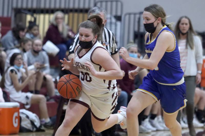 Marengo’s Addie Johnson charges with the ball against Johnsburg during girls varsity basketball action in Marengo Thursday night.