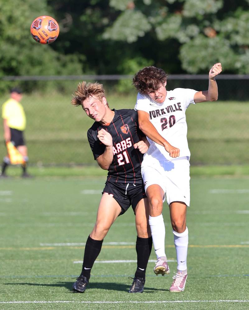 DeKalb's Sean Kolkebeck and Yorkville's Kyle Nadler go for a header during their game Thursday, Aug. 25, 2022, in the Barb Cup at the Northern Illinois University Outdoor Recreation Sports Complex.