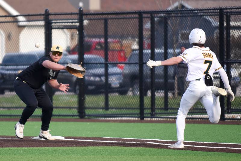 Bishop McNamara's Max Rohr, left, fields a throw at first base ahead of Coal City's Gavin Berger during a game at Coal City Thursday, April 3, 2025.