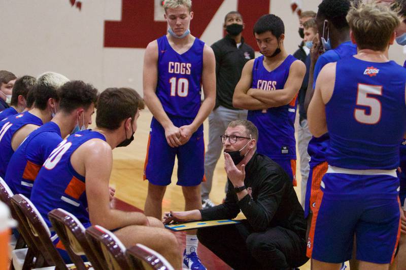Genoa-Kingston's Coach Ethan Franklin talks to the team during a timeout against Sycamore at the 71st. Annual E.C. Nichols Holiday Classic Tournament on Dec.21, 2021 in Marengo.