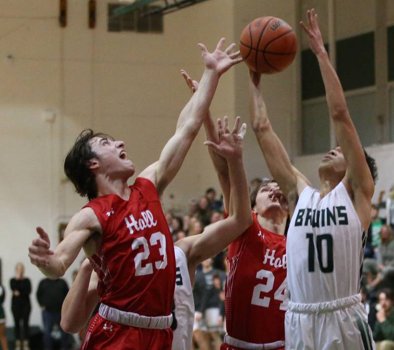 St. Bede's Isaiah Hart (right) grabs a rebound over Hall's Braden Curran (left) and teammate Kylan Smith (center) on Monday, Dec. 14, 2022 at St. Bede Academy.