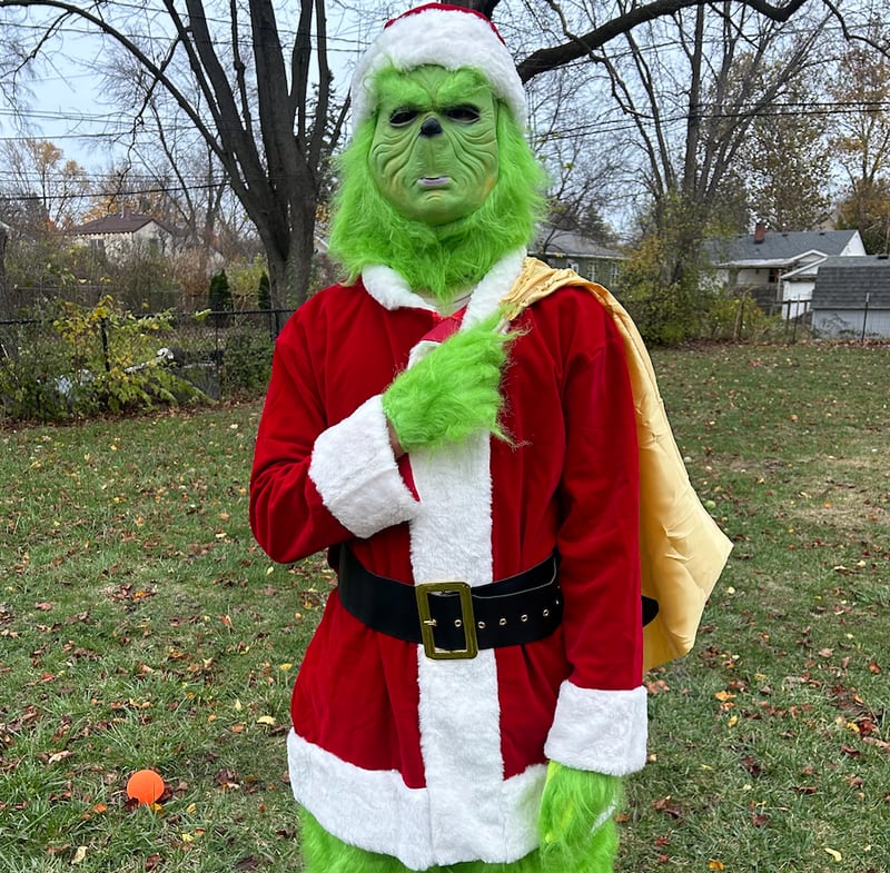 Westmont High School freshman Trevor Robertson is spending time this holiday season entertaining as the Grinch.