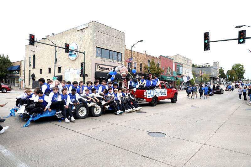 St. Charles North football players ride on Route 64 on Friday, Sept. 27, 2024 during the school’s annual homecoming parade in St. Charles.