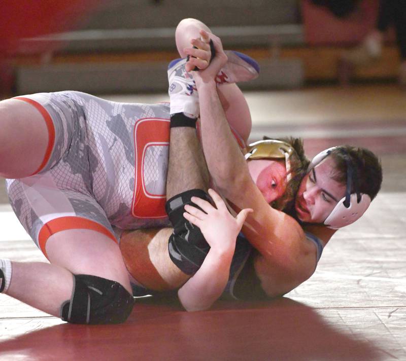 Oregon's jacksyn Windham tries to break a hold by Newman's Matthew Clemen during their 215-pound bout at the Oregon Quad meet on Saturday, Jan. 17, 2026 at the Blackhawk Center in Oregon.