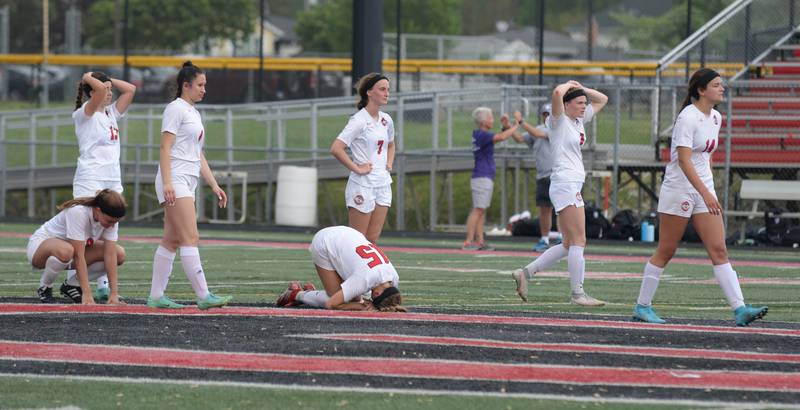 Glenbard East reacts to their loss against Downers Grove North during the regional final game against Glenbard East Friday May 20, 2022.