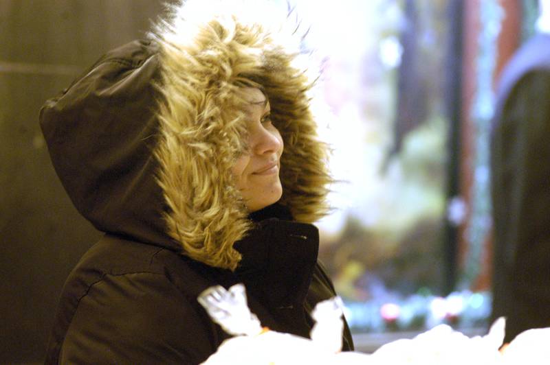 Bundled from the cold, Amanda Thompson hands out Sterling Theater popcorn during Sterlings Sights and Sounds festivities. Sterling's Sights & Sounds is Sterling’s kickoff to the holiday season. The event in downtown Sterling was held on Friday, December 5, 2025.