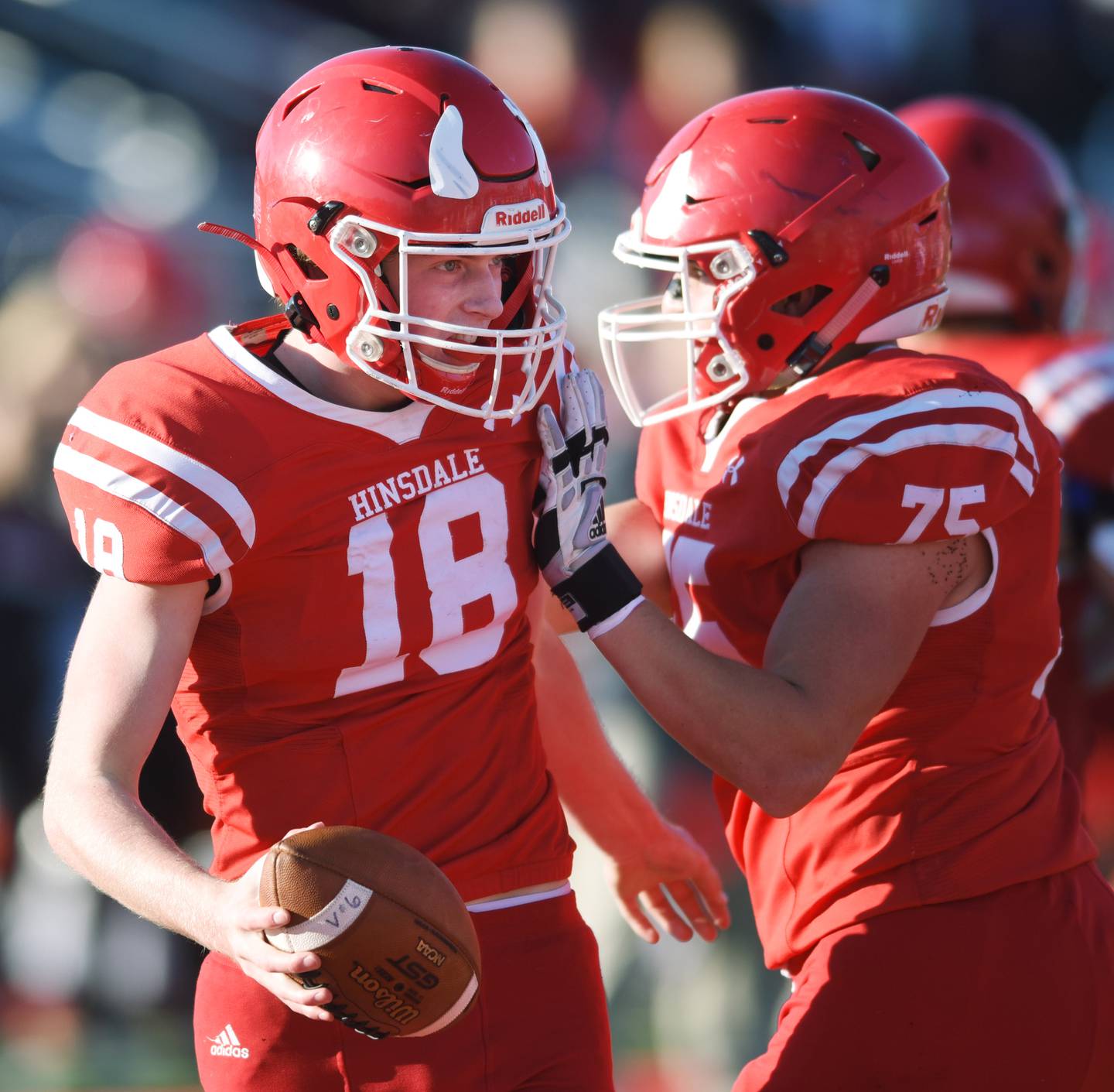 Hinsdale Central quarterback Billy Cernugel, left, celebrates his fourth-quarter touchdown with teammate Matt Ortiz during the second round of the Class 8A high school football playoffs against Glenbrook South Saturday.