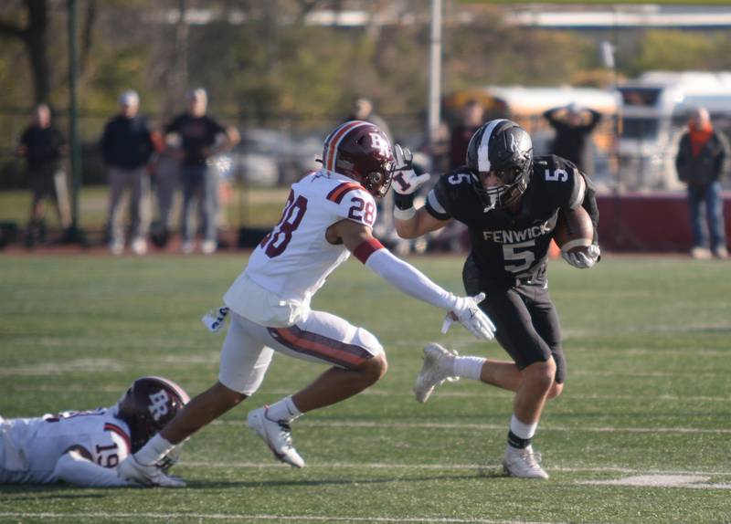 Fenwick's Jack Paris gets past  Brother Rice defense during their playoff game Saturday, Nov. 2, 2024.