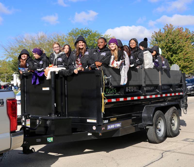 The Plano High School Cheerleaders participate in the Plano High School Homecoming Parade on Saturday, Oct. 7, 2023 in Plano.