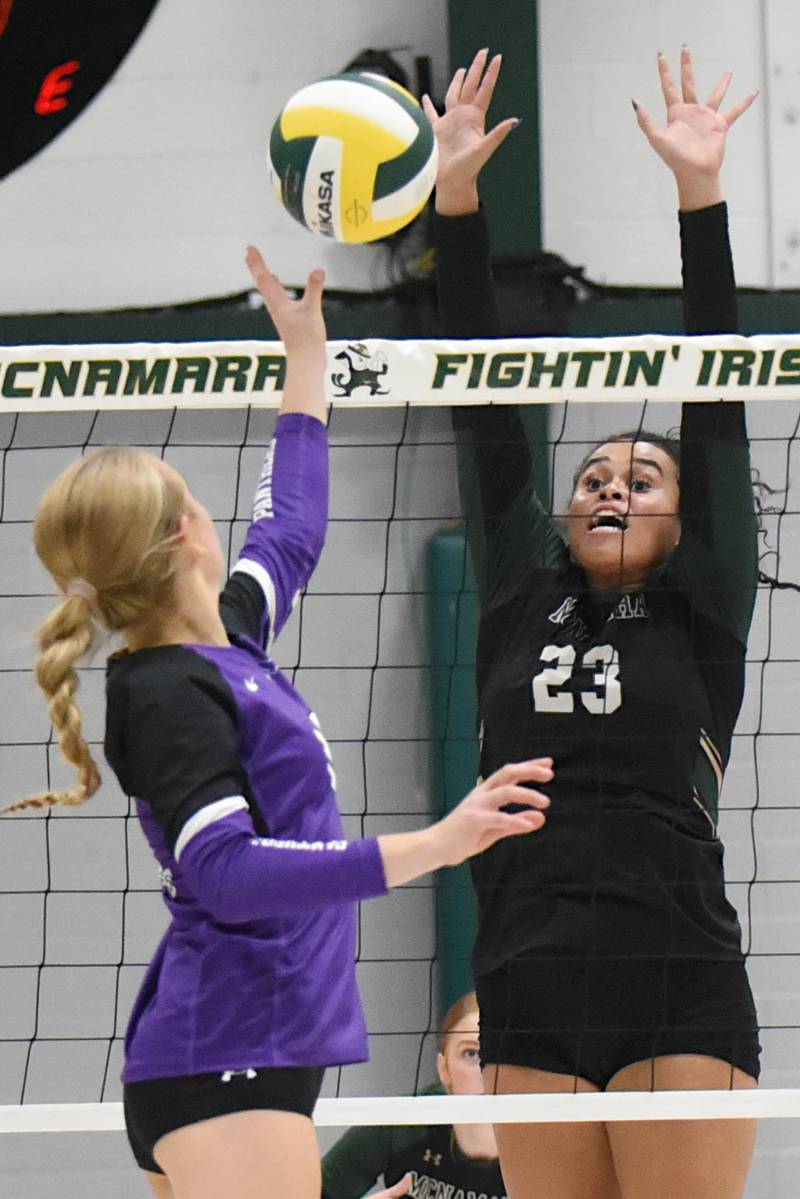 Bishop McNamara's Journey Slone, right, looks to block a Manteno hit during a home game against the Panthers Monday, Oct. 20, 2025.
