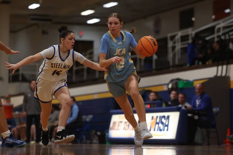 Joliet Catholic’s Abigail Dulinsky drives to the baseline against Joliet Central on Monday, Jan. 6, 2025 in Joliet.
