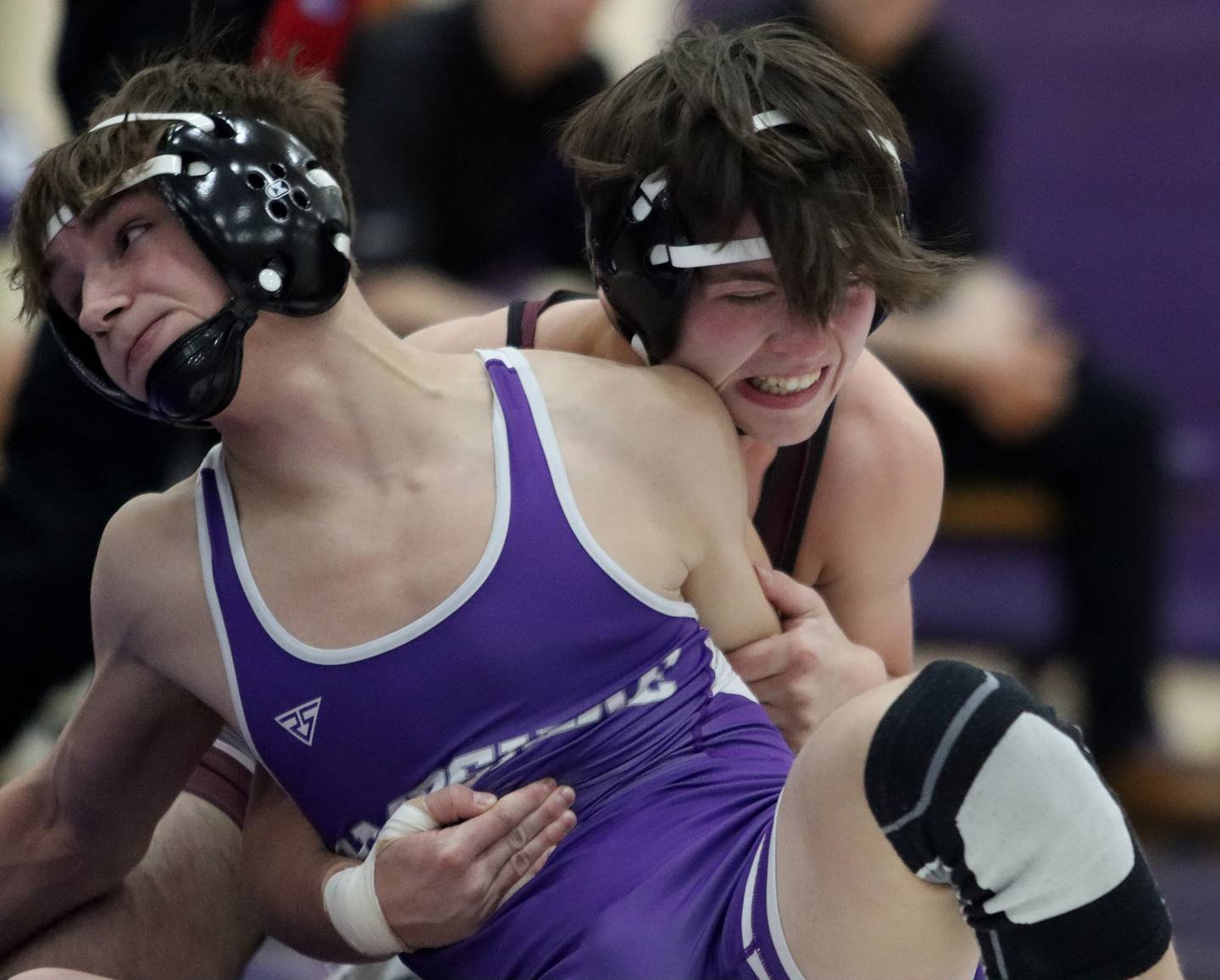Hampshire’s David Becker, front, battles Prairie Ridge’s Mikey Meade at 132 pounds in varsity wrestling on Thursday, Dec. 5, 2024 at Hampshire High School in Hampshire.