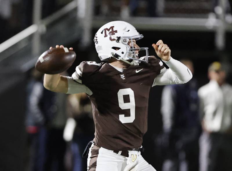Mt. Carmel's Jack Elliott (9) looks to pass during the varsity football game between Loyola Academy and Mt. Carmel high school on Friday, Oct. 25, 2024 in Chicago.