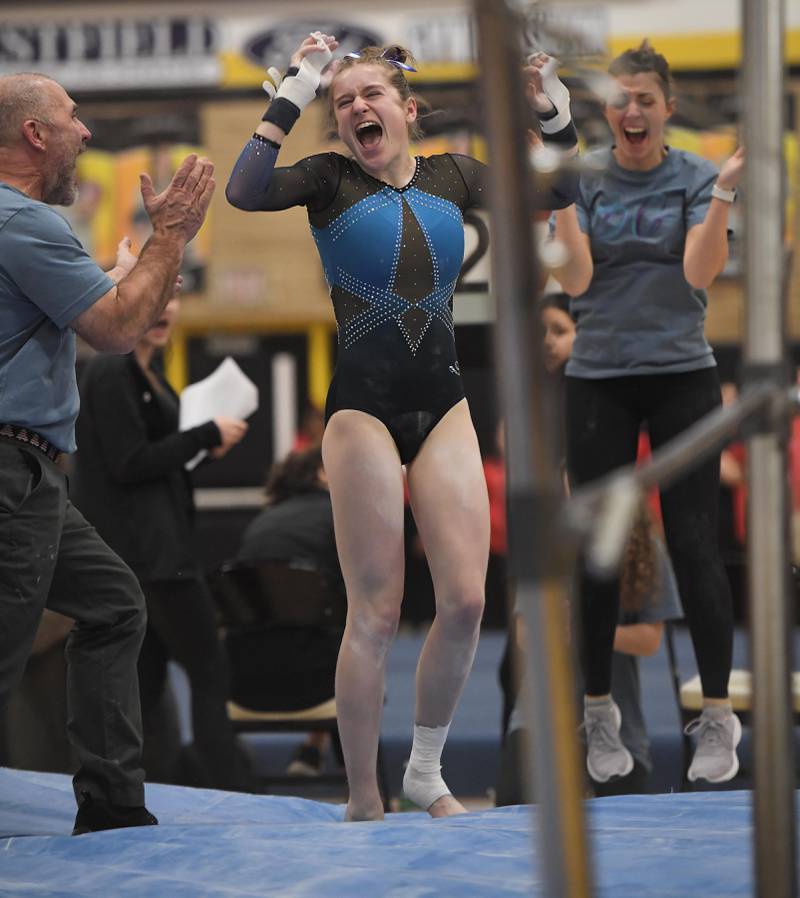 Kathryn Snouffer of Downers Grove South High School reacts to her uneven parallel bars routine at the Hinsdale South girls gymnastics sectional meet in Darien on Tuesday, February 7, 2023.