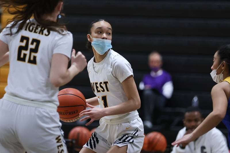 Joliet West’s Caiside Snapp looks for a play against Joliet Central in the Class 4A Moline Regional semifinal. Tuesday, Feb. 15, 2022, in Joliet.