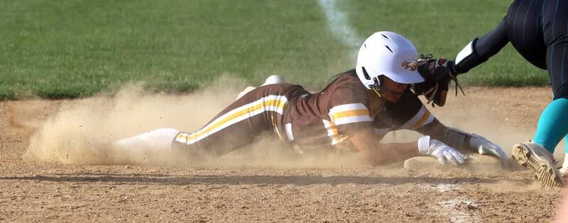 Jacobs’ Jianna Tanada arrives safely at third base against Woodstock North in varsity softball at Algonquin Friday night.