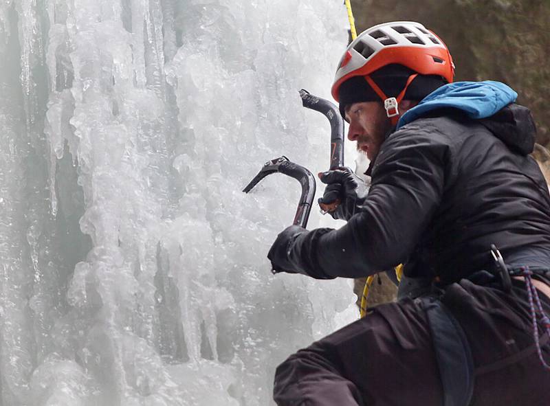 Cody Miller, of Rochelle, uses an ice tool pick to dig into the frozen ice-fall at Wildcat Canyon in Starved Rock State Park on Friday Jan. 14, 2022 near Utica.