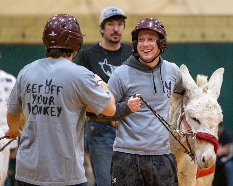 Members of the 'Village Church' team laugh during game of Donkey Basketball on Saturday, Feb. 7, 2026 at Seneca High School West Campus in Seneca.