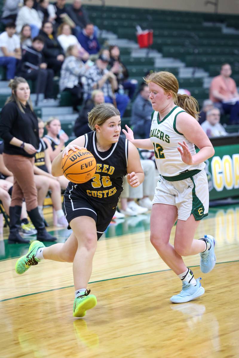 Reed-Custer's Harlie Liebermann dribbles to the lane against Coal City's Jori Tucker during the Comets' 50-43 victory over Coal City on Monday, Jan. 11, 2026.