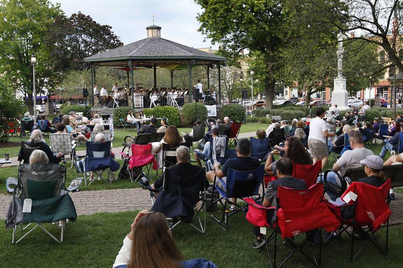 People watch the performance of the Woodstock City Band on Wednesday, July 24, 2024, in the historic Woodstock Square. The band that is in its 140th season, performed their Galloping through the Gallery concert for the crowd.