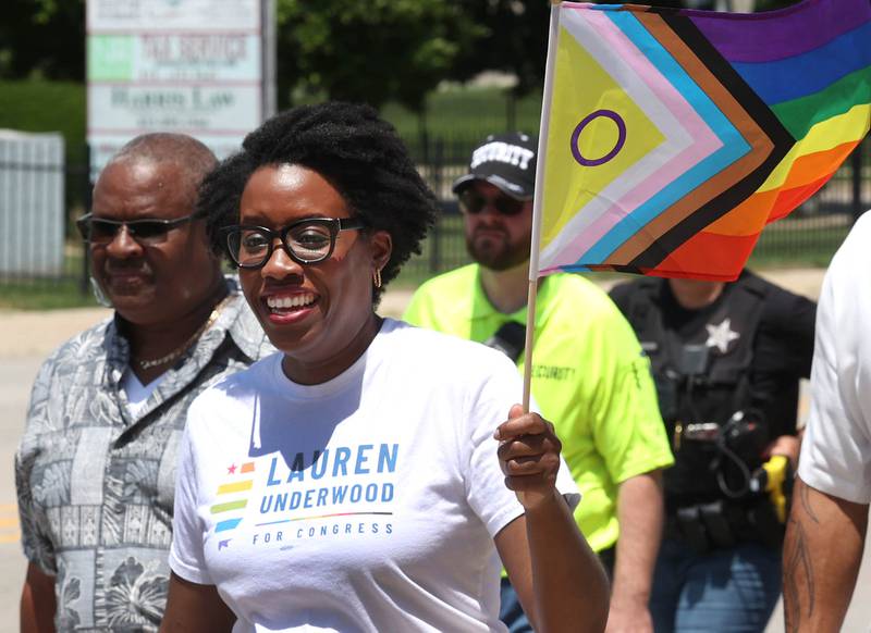 U.S. Rep. Lauren Underwood, D-Naperville, marches with the parade south on First Street Saturday, June 21, 2025, during the DeKalb Pride Fest in downtown DeKalb.