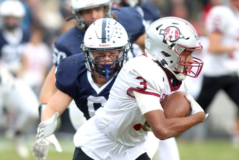 Cary-Grove’s Charles Ciske closes in on Antioch ballcarrier Martin Cohen in IHSA Class 6A second-round playoff football action on Saturday, Nov. 9, 2024, at Al Bohrer Field on the campus of Cary-Grove High School in Cary..