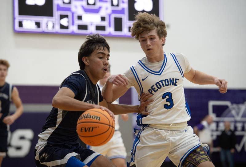 IC Catholic's Gael Mendoza, left, controls the ball as Peotone's Nick Cronin, right, defends in the Thanksgiving tournament at Manteno High School on Monday, November 24, 2025.