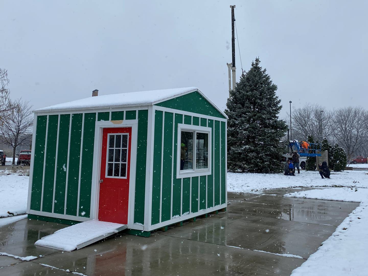 Santa's House in the Jordan block with the new Christmas tree going up behind it.