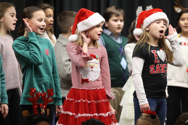A youth choir performs at the Joliet Area Historical Museum at the Joliet Light Up the Lights Holiday Festival on Friday, Nov. 29, 2024.