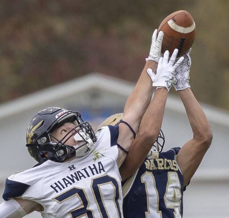 Polo’s Jordan Reed and Hiawatha’sTim Pruitt go up for a pass Saturday, Nov. 1, 2025, in the 8-man football playoff quarterfinals.