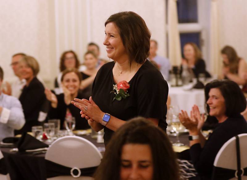 People clap for Vanessa Haase of North Elementary School after she won the student support award during the the Educator of the Year Dinner, Saturday, May 6, 2023, at Hickory Hall, in Crystal Lake. The annual awards recognize McHenry County’s top teachers, administrators and support staff.